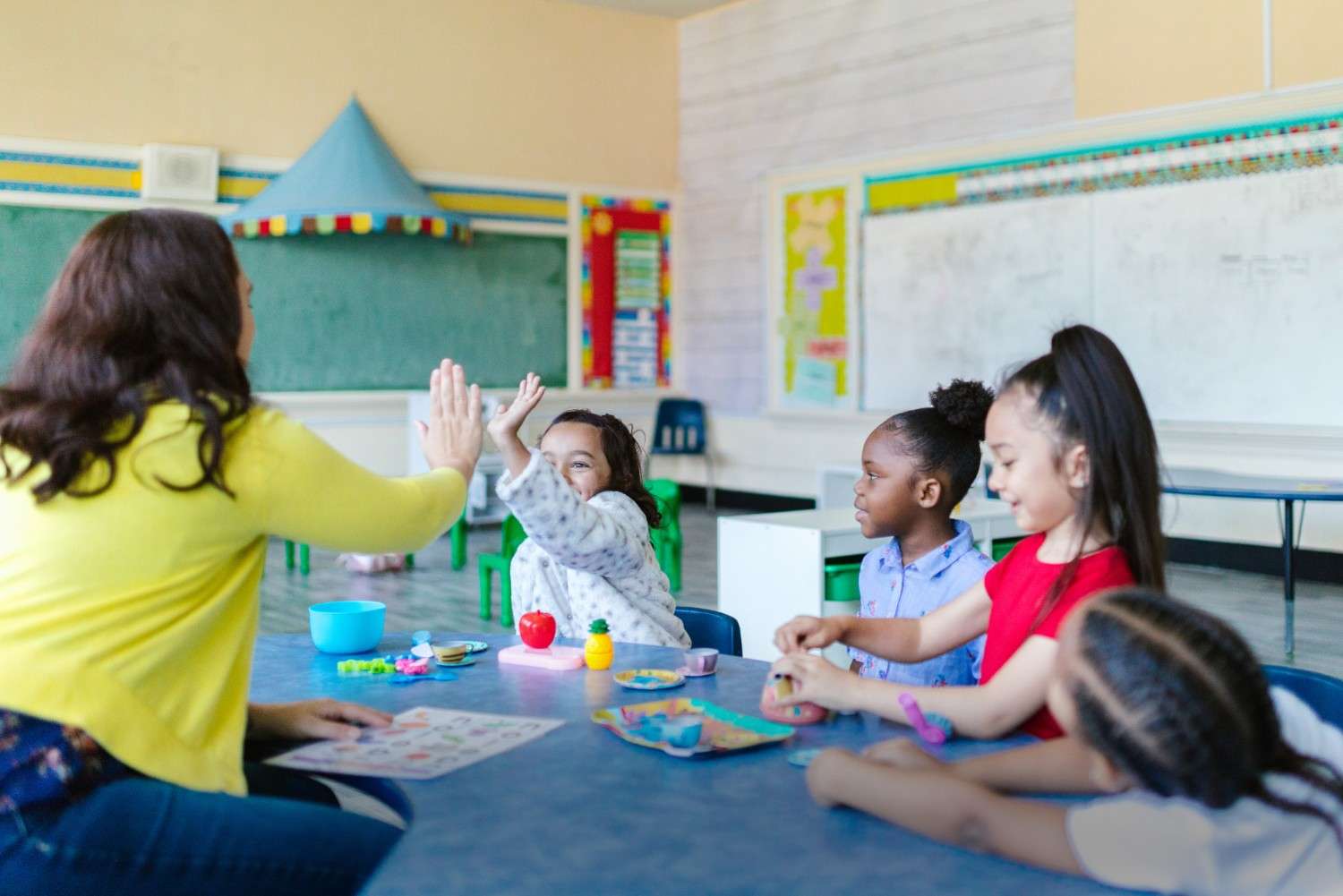 Montessori teacher with students