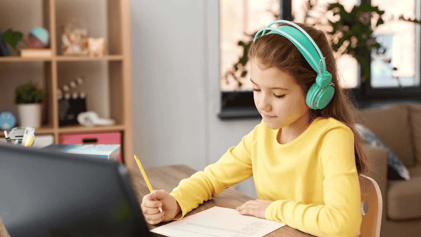 A young girl attending Online school class